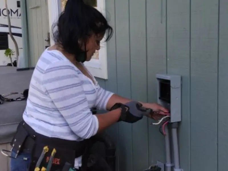 Licensed electrician wiring an exterior subpanel in Carnegie